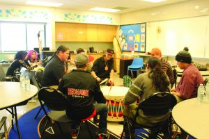 Photo of a classroom with students and teacher