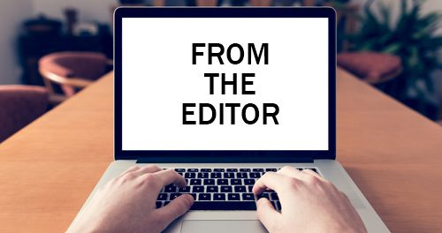 A photo of hands typing on a laptop with the words, from the editor showing on the screen.