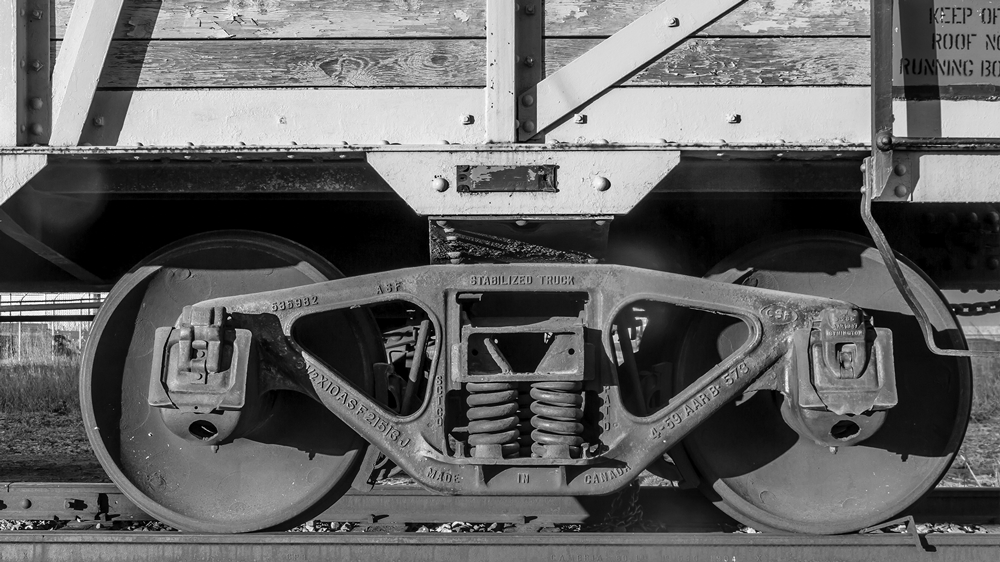 Photo of the train wheels on an old box car